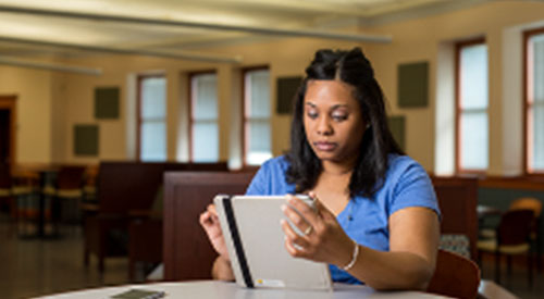 Student studying on tablet