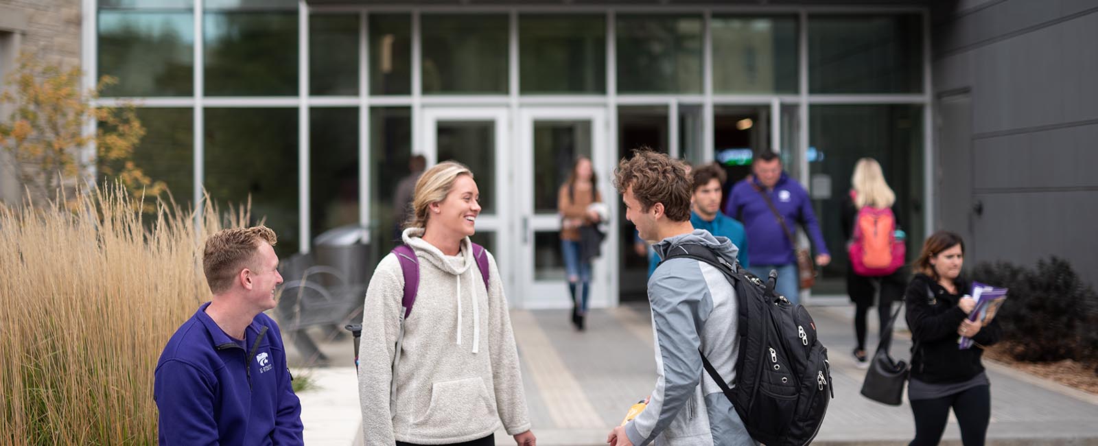 Student working together on a sunny day on the Manhattan campus