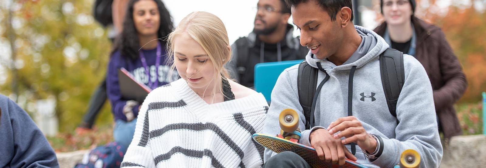 Student working together on a sunny day on the Manhattan campus